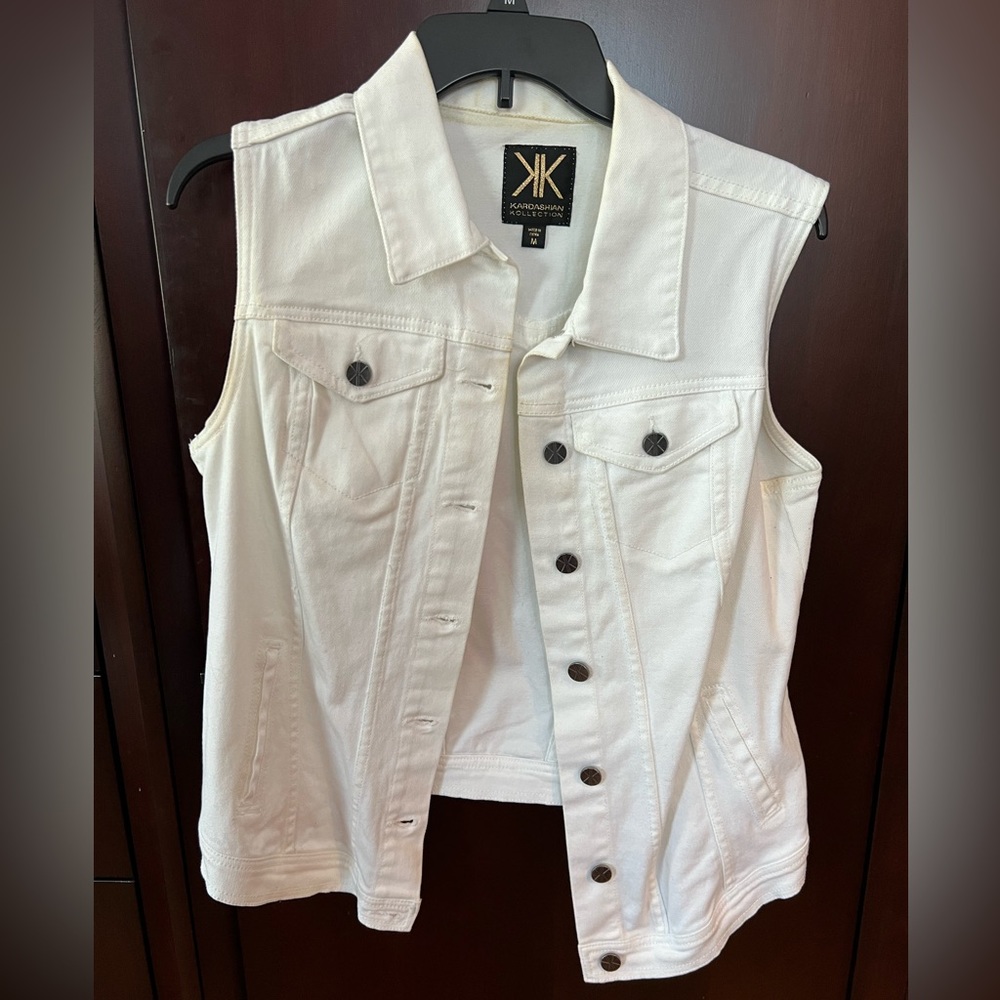 Sleeveless white denim jacket